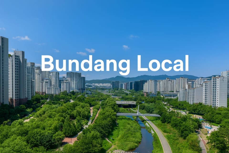 Aerial view of Bundang city with Tancheon River, green parks, and modern apartments under a clear blue sky — header image for Bundang Local expat and tourist guide.